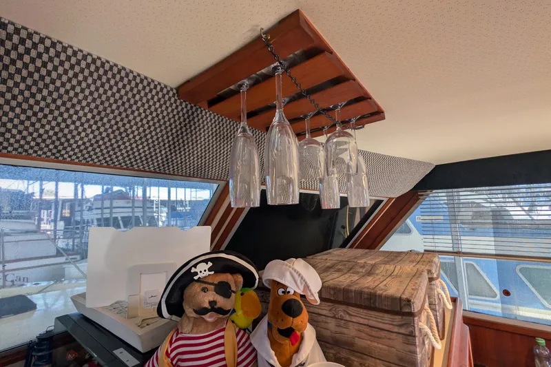 Slide: The Image of Interior of 1984 Chris-Craft 382 Commander with pirate-themed decor and hanging glasses. - 51