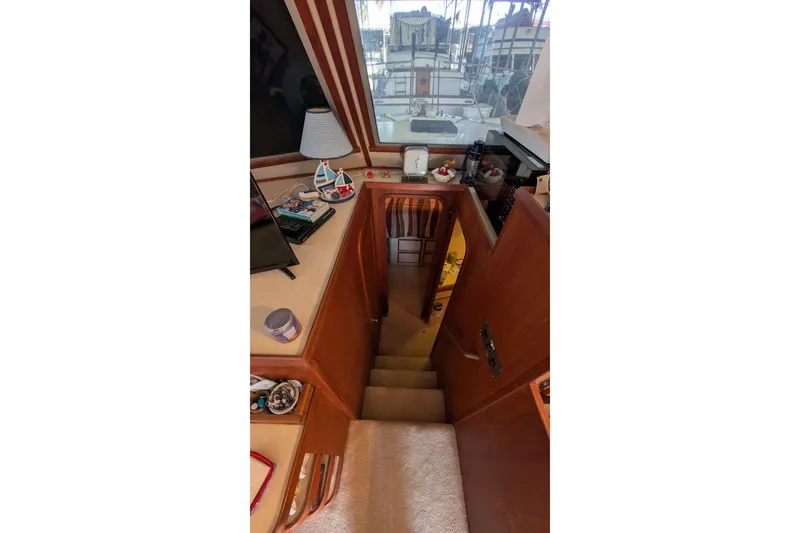 Slide: The Image of Interior view of 1984 Chris-Craft 382 Commander yacht with stairs and nautical decor. - 52
