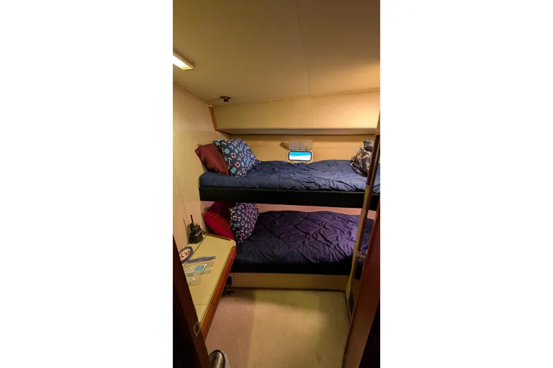 Slide: The Image of 1984 Chris-Craft 382 Commander cabin with bunk beds and cozy interior. - 74
