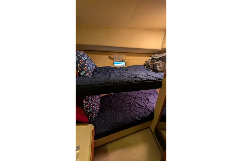 Slide: The Image of Interior of 1984 Chris-Craft 382 Commander with cozy bunk beds and nautical decor. - 76