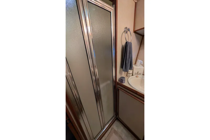 Slide: The Image of Bathroom interior of 1984 Chris-Craft 382 Commander with shower and sink. - 85