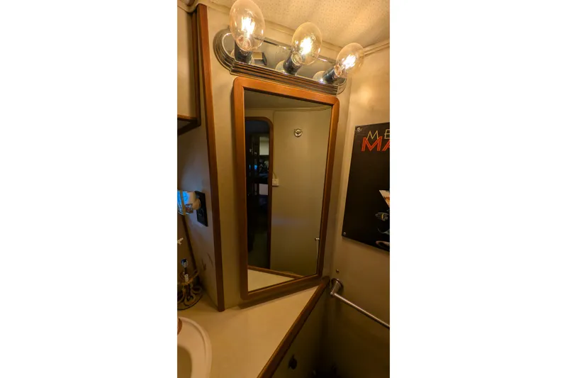 Slide: The Image of Bathroom interior of 1984 Chris-Craft 382 Commander with mirror and lighting fixtures. - 87