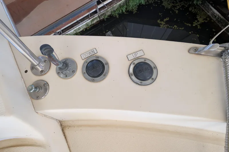 Slide: The Image of 1984 Chris-Craft 382 Commander boat controls with "UP" and "DOWN" labeled buttons. - 91