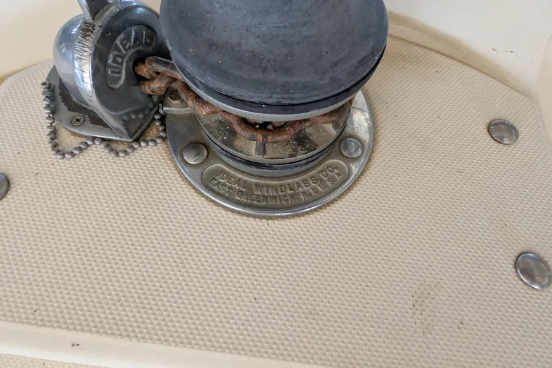 Slide: The Image of 1984 Chris-Craft 382 Commander boat windlass detail with Ideal Windlass Co. branding. - 93