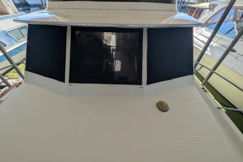 Slide: The Image of 1984 Chris-Craft 382 Commander boat deck with windows and railing. - 95