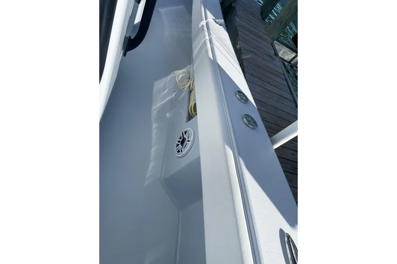 Slide: The Image of 2022 Conch 33 boat deck with speaker and rope, dockside view. - 10