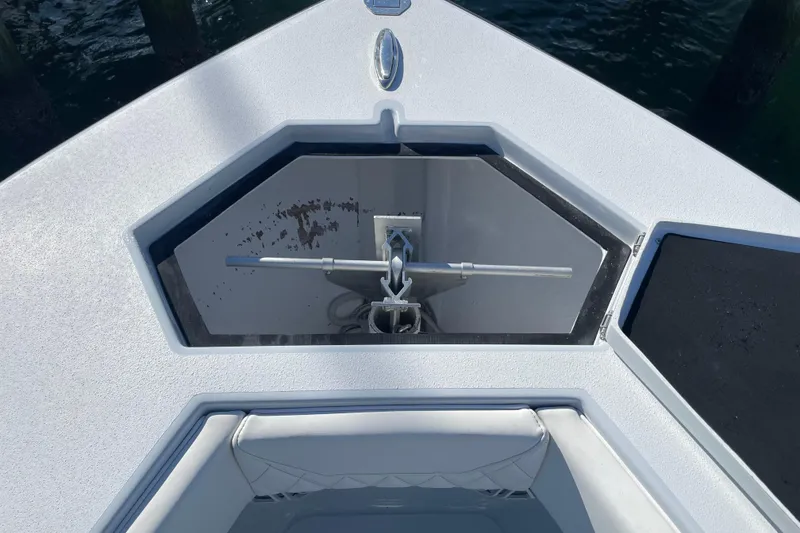 Slide: The Image of Bow anchor compartment of 2022 Conch 33 boat, featuring a sleek design. - 18