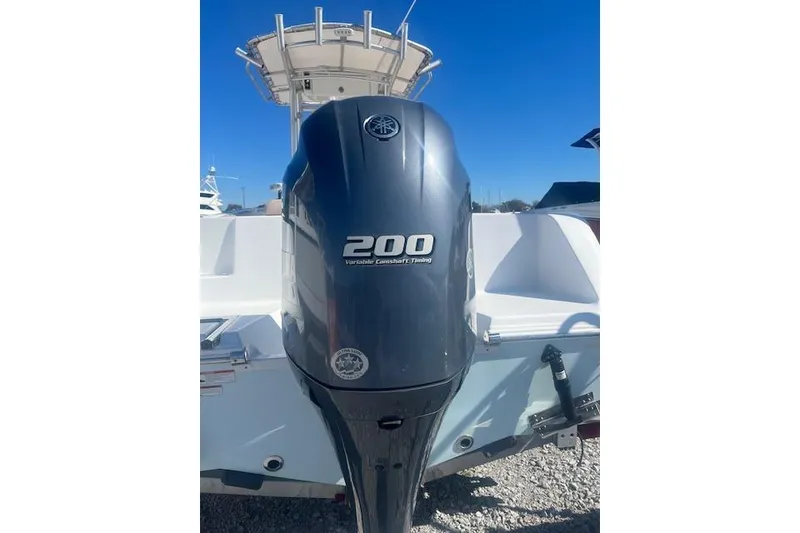 Slide: The Image of 2020 Sportsman Open 232 Center Console with 200 horsepower outboard motor. - 2
