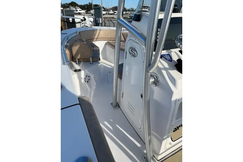 Slide: The Image of 2020 Sportsman Open 232 Center Console boat interior with seating and console view. - 7