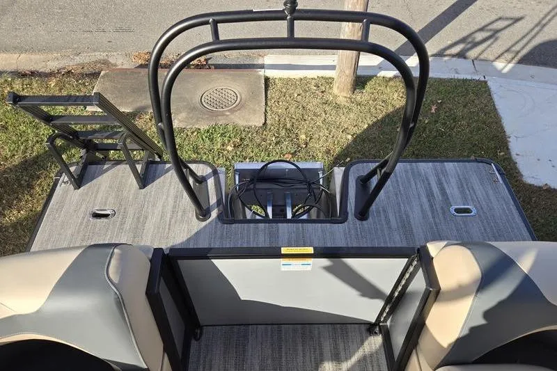 Slide: The Image of 2025 Godfrey Sweetwater 2286 QS boat deck with seating and railing, viewed from above. - 17