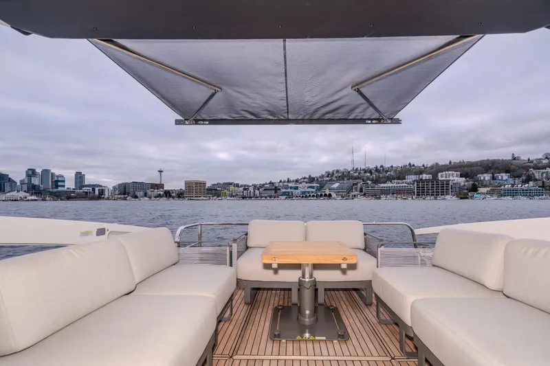 Slide: The Image of Luxurious Absolute 48 Coupe yacht interior with city skyline view, 2026 model. - 12