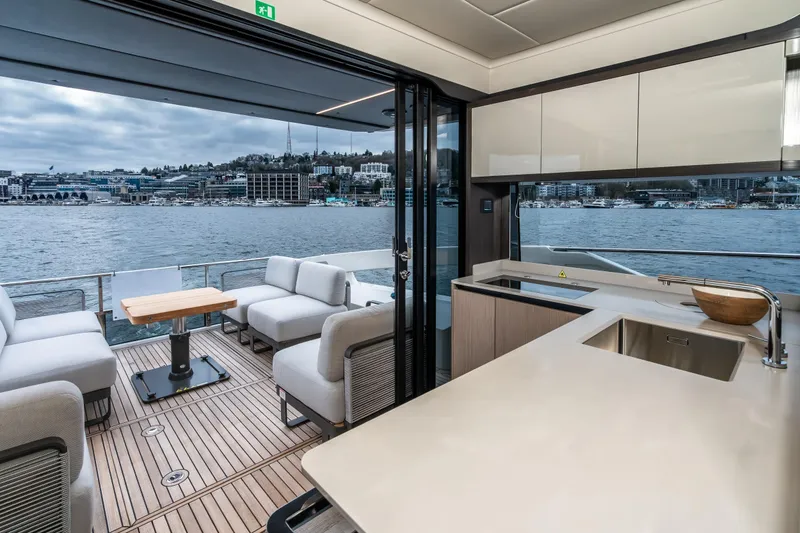 Slide: The Image of Luxurious interior of 2026 Absolute 48 Coupe yacht with waterfront view. - 16