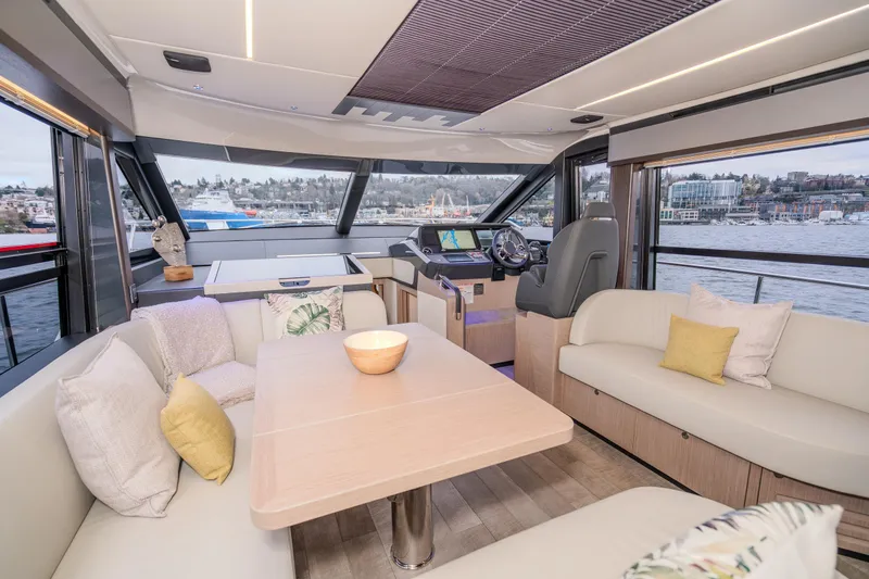 Slide: The Image of Luxurious interior of 2026 Absolute 48 Coupe yacht with scenic water views. - 18