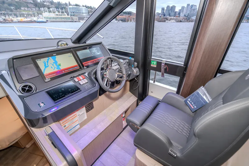 Slide: The Image of Luxurious helm of 2026 Absolute 48 Coupe yacht with advanced navigation displays. - 27