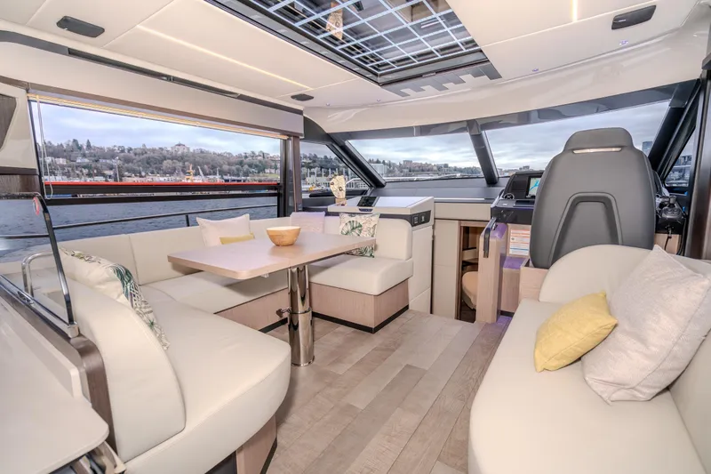 Slide: The Image of Luxurious interior of 2026 Absolute 48 Coupe yacht with modern seating and panoramic windows. - 29