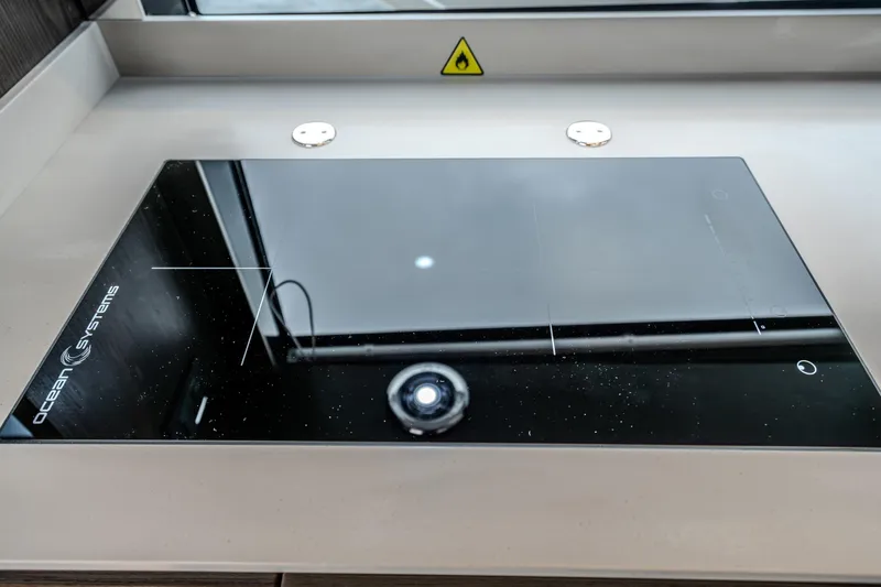 Slide: The Image of Modern induction cooktop on Absolute 48 Coupe yacht, 2026 model. - 33