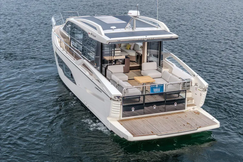 Slide: The Image of Luxury Absolute 48 Coupe yacht, 2026 model, cruising on open water. - 4