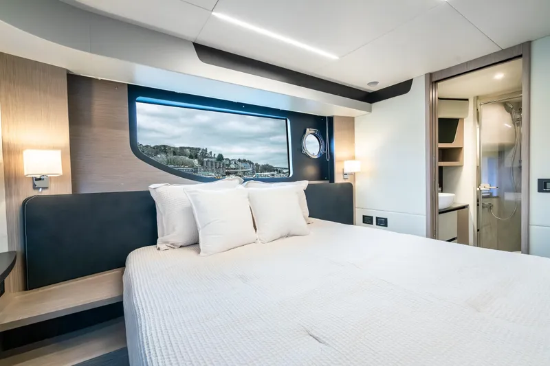 Slide: The Image of Luxurious interior of 2026 Absolute 48 Coupe yacht with modern bedroom and ensuite bathroom. - 41