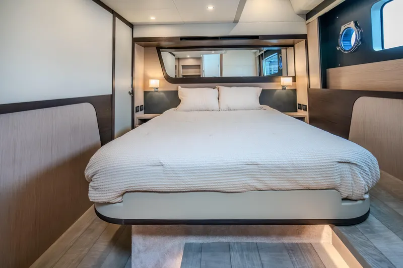 Slide: The Image of Luxurious bedroom interior of 2026 Absolute 48 Coupe yacht, featuring modern design and cozy bedding. - 45