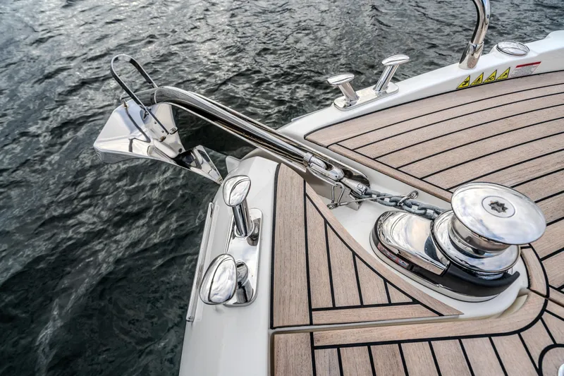 Slide: The Image of Sleek deck of 2026 Absolute 48 Coupe yacht with polished chrome fittings. - 49