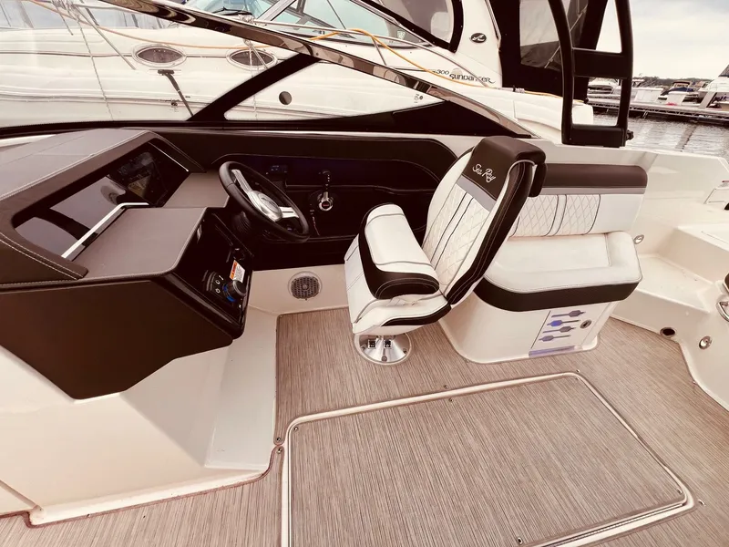 Slide: The Image of Interior of a 2017 Sea Ray SLX 250 boat with helm station. - 16