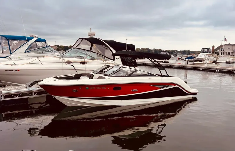 Slide: The Image of 2017 Sea Ray SLX 250 boat docked at marina. - 2