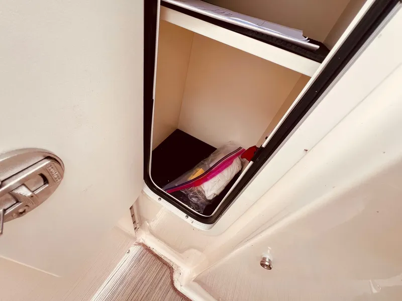 Slide: The Image of Storage compartment in 2017 Sea Ray SLX 250 boat. - 27