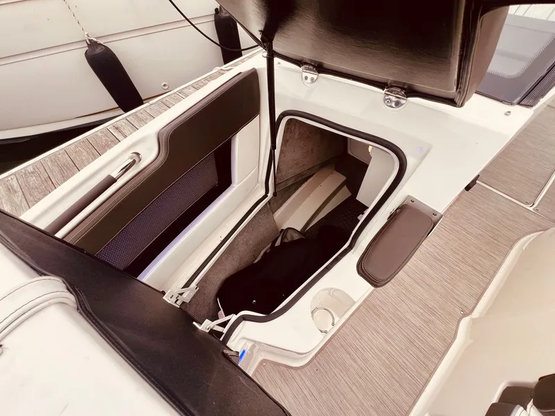 Slide: The Image of Storage compartment in 2017 Sea Ray SLX 250 boat. - 28