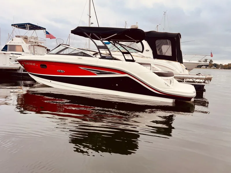 Slide: The Image of 2017 Sea Ray SLX 250 boat docked at marina. - 4