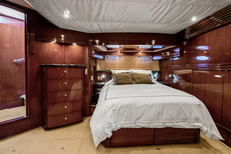 Slide: The Image of Luxurious bedroom interior of 1999 Carver 53 Voyager yacht with elegant wood finish. - 19