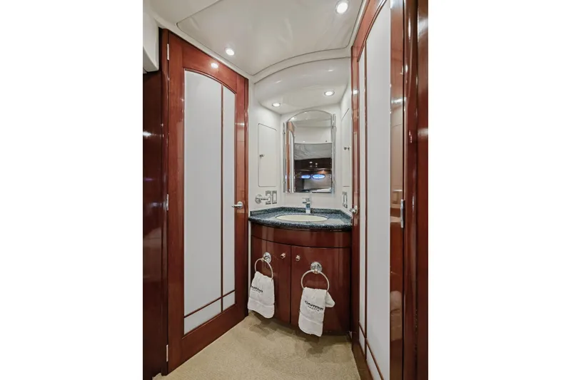 Slide: The Image of Luxurious bathroom in 1999 Carver 53 Voyager yacht with elegant wood finishes. - 23