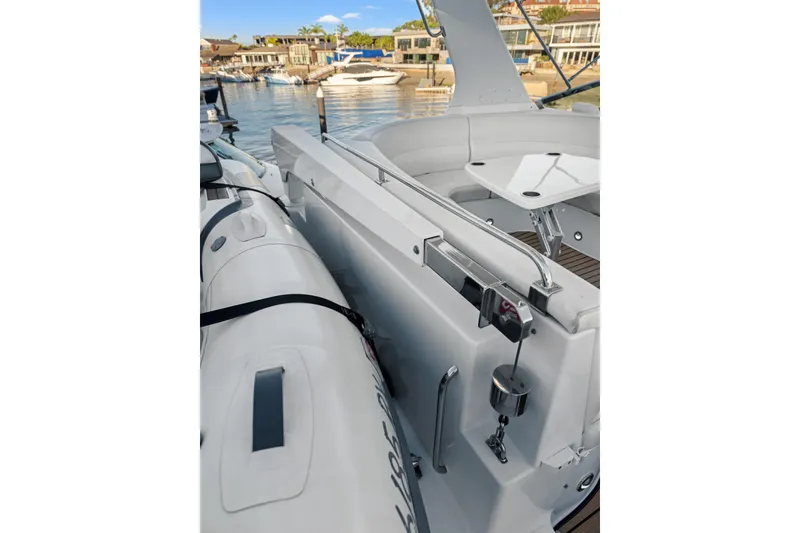 Slide: The Image of 1999 Carver 53 Voyager yacht deck with inflatable boat, docked at marina. - 35