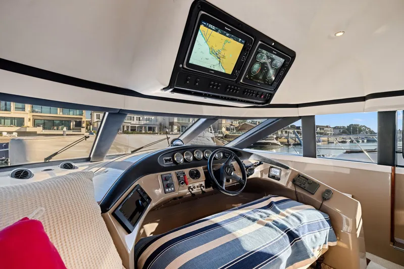 Slide: The Image of Interior of 1999 Carver 53 Voyager yacht with navigation system and steering wheel. - 13