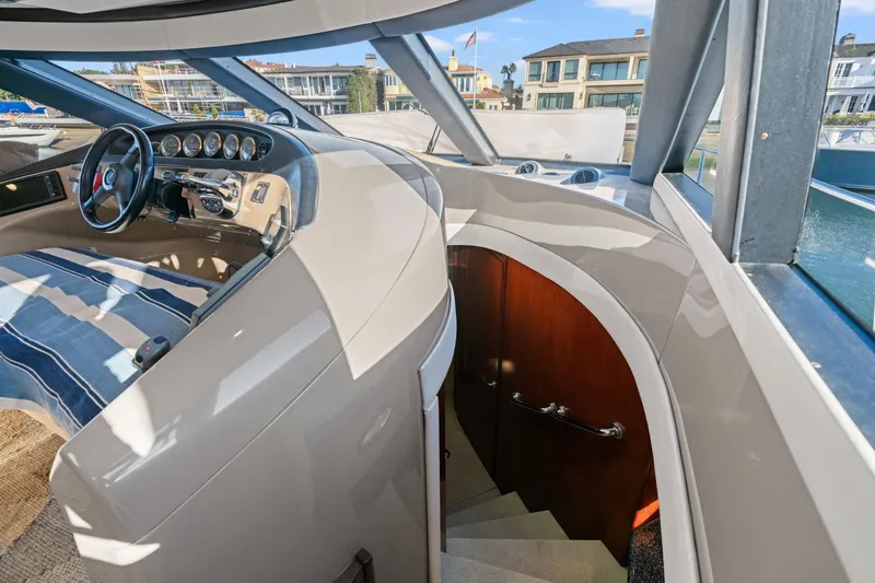 Slide: The Image of Interior view of 1999 Carver 53 Voyager yacht helm and staircase. - 14