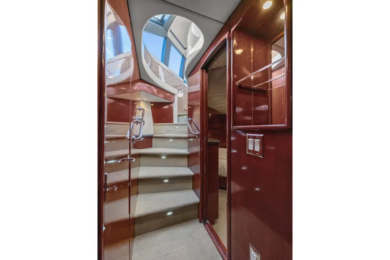 Slide: The Image of Luxurious interior of 1999 Carver 53 Voyager yacht with elegant wooden finishes. - 15