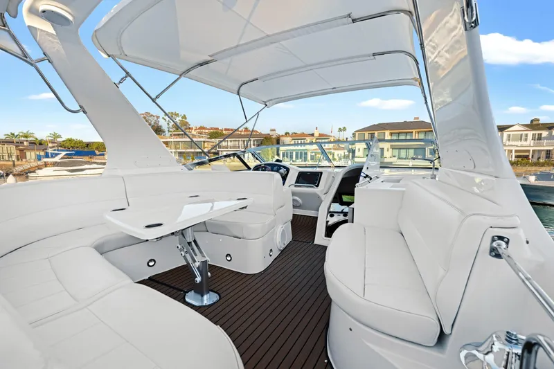 Slide: The Image of Luxurious 1999 Carver 53 Voyager yacht interior with white seating and modern design. - 29