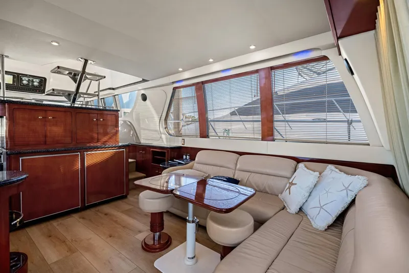 Slide: The Image of Interior of 1999 Carver 53 Voyager yacht with modern kitchen and wooden cabinetry. - 7