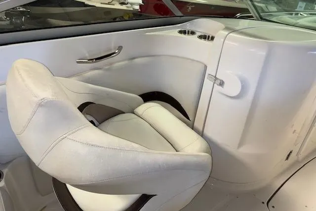 Slide: The Image of 2015 Hurricane SunDeck 2200 OB boat interior with white seating and cup holders. - 10