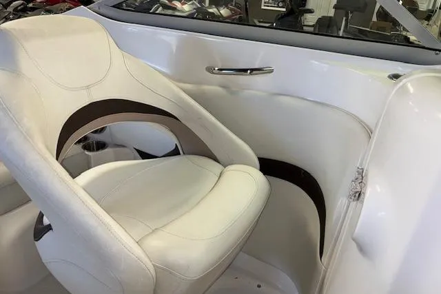 Slide: The Image of 2015 Hurricane SunDeck 2200 OB boat interior with white seating and sleek design. - 17