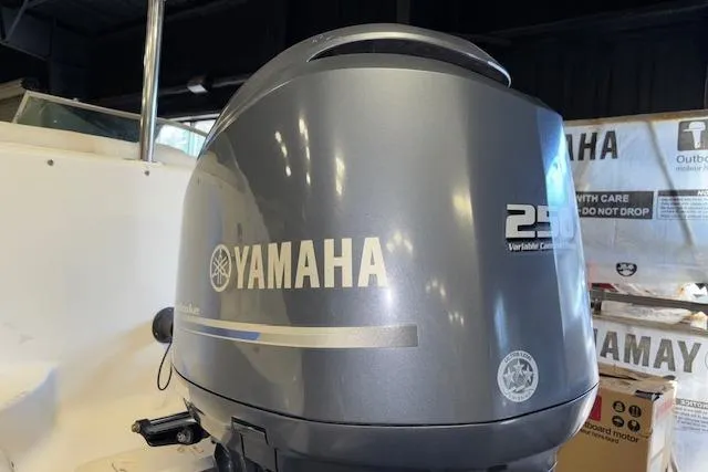 Slide: The Image of Yamaha outboard motor on 2015 Hurricane SunDeck 2200 OB boat, indoor setting. - 22