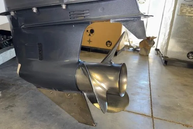 Slide: The Image of 2015 Hurricane SunDeck 2200 OB boat propeller in a garage setting. - 23