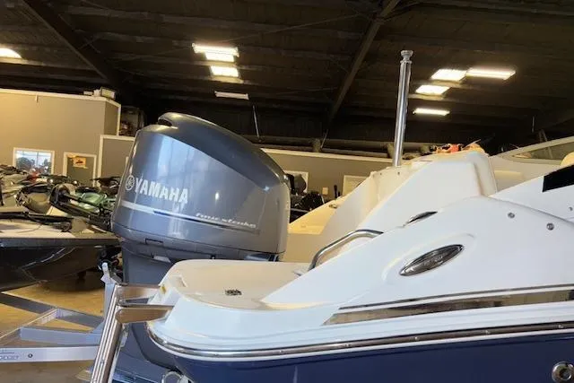 Slide: The Image of 2015 Hurricane SunDeck 2200 OB boat with Yamaha outboard motor in showroom. - 27