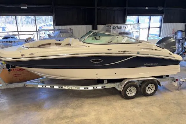 Slide: The Image of 2015 Hurricane SunDeck 2200 OB boat on trailer in indoor showroom. - 30