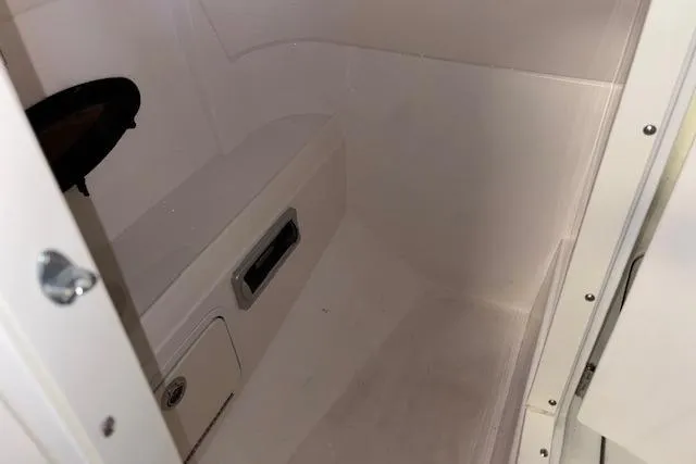 Slide: The Image of Interior of 2015 Hurricane SunDeck 2200 OB boat, featuring storage compartment. - 36
