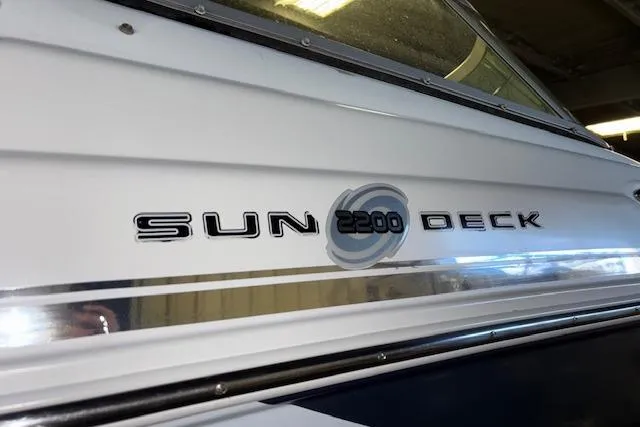 Slide: The Image of 2015 Hurricane SunDeck 2200 OB boat logo on side view. - 4