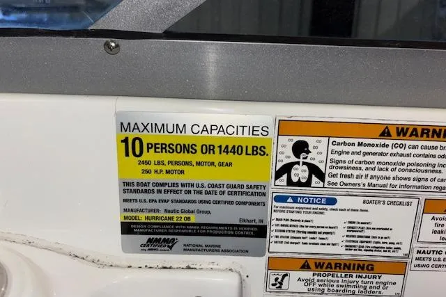 Slide: The Image of 2015 Hurricane SunDeck 2200 OB capacity label, max 10 persons or 1440 lbs, safety warnings. - 45
