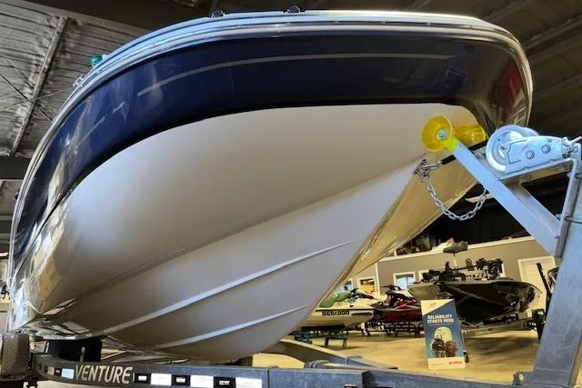 Slide: The Image of 2015 Hurricane SunDeck 2200 OB boat on trailer in showroom. - 47