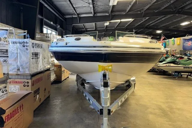 Slide: The Image of 2015 Hurricane SunDeck 2200 OB boat on trailer in indoor showroom. - 6