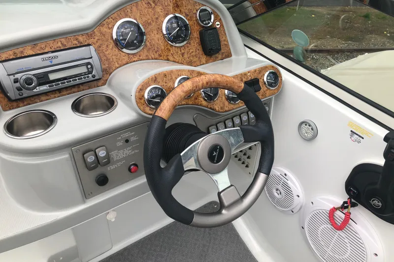 Slide: The Image of 2007 Formula 260 Sun Sport dashboard with wood accents and steering wheel. - 11