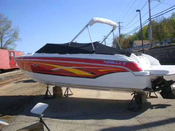 Slide: The Image of 2007 Formula 260 Sun Sport boat propped up outdoors. - 2